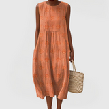 Elegant sleeveless midi dress with side pockets and lightweight fabric for women, comfortable and versatile for summer or everyday wear