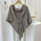 Triangular knitted scarf with leather buckle
