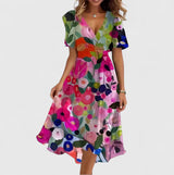 Women's floral midi dress with V-neck, short sleeves and flowing skirt, elegant and lightweight for summer