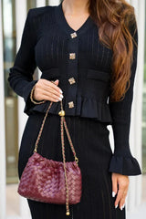 Women's fitted outfit with cardigan and midi skirt