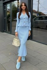Women's fitted outfit with cardigan and midi skirt