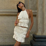 Women's two-piece pleated outfit with halter neck