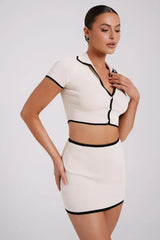 Women's white mini dress with black ribbed trim