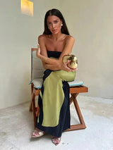 Women's strapless maxi dress with flowing abstract patterns