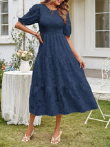 Textured women's midi dress with short sleeves and ruffles