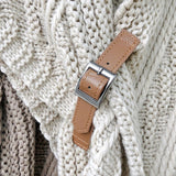 Triangular knitted scarf with leather buckle