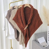 Triangular knitted scarf with leather buckle