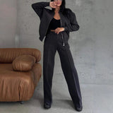 Set with jacket with zipper and trousers with wide leg