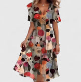 Women's floral midi dress with V-neck, short sleeves and flowing skirt, elegant and lightweight for summer