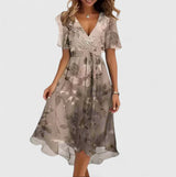 Women's floral midi dress with V-neck, short sleeves and flowing skirt, elegant and lightweight for summer