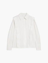 Women's white oversized shirt with structured shoulders and V-neck