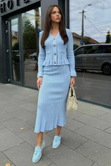 Women's fitted outfit with cardigan and midi skirt
