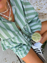 Women's summer outfit with green stripes: blouse and shorts