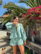 Women's summer outfit with green stripes: blouse and shorts