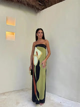 Women's strapless maxi dress with flowing abstract patterns